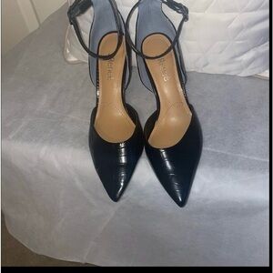 J Renee size 8.5 black with silver heel.